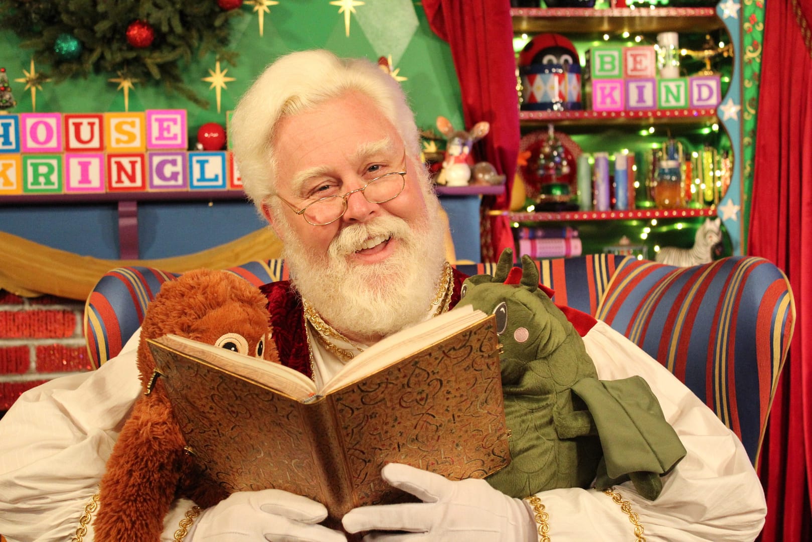 Santa reading to friends at the House of Kringle