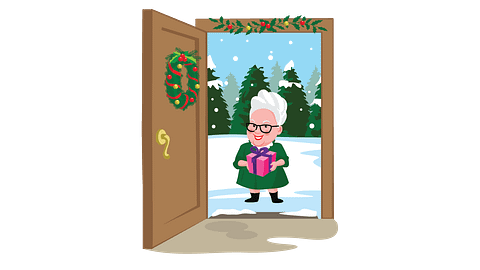 Mrs. Claus standing at an open decorated door, holding a gift with snowy pine trees in the background