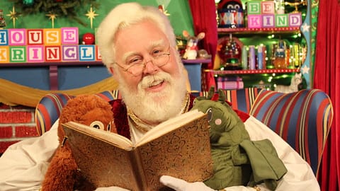 Santa reading to friends at the House of Kringle