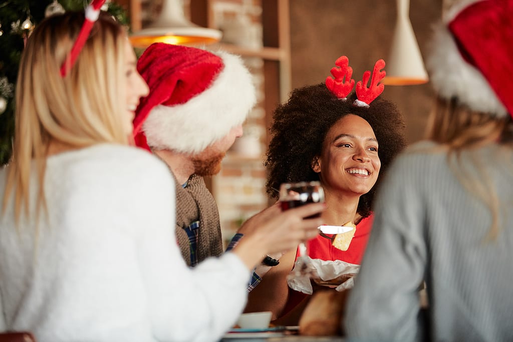 stock photo friends having dinner for christmas eve at home