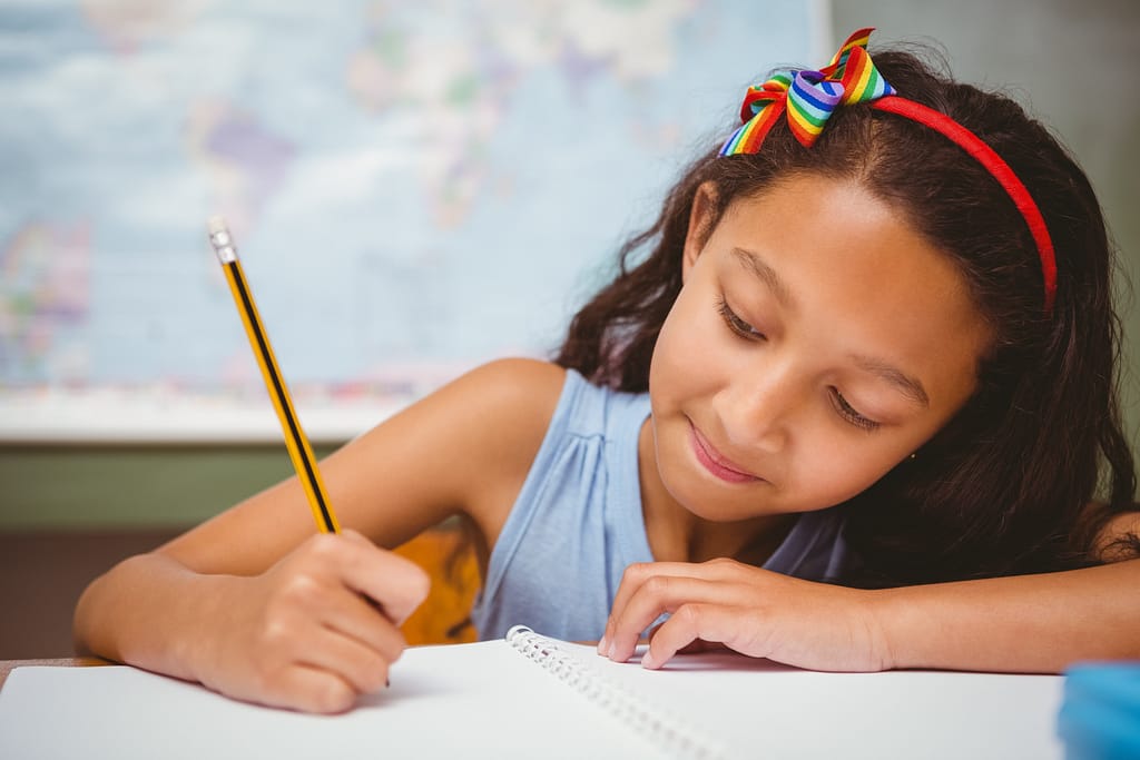 Indoor activities, like this girl who is writing a thank you letter, is a fun activity for a cold winter day.