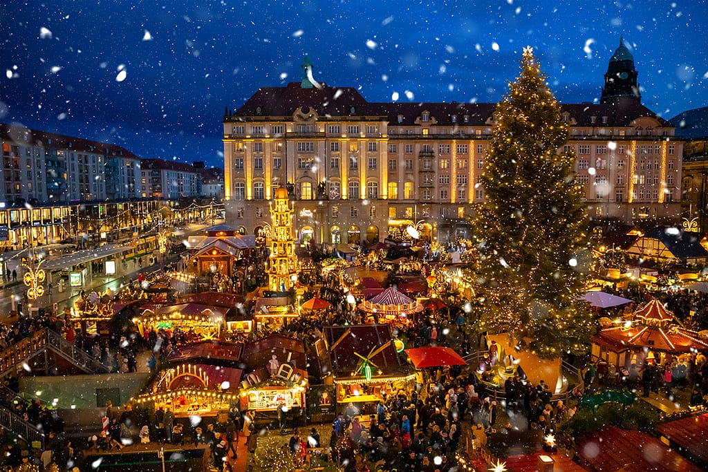 People Visit Christmas Market Striezelmarkt In Dresden Germany