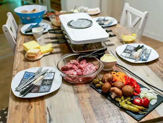 Dutch Raclette Table Filled With Ingredients For A Celebratory Evening Like Christmas