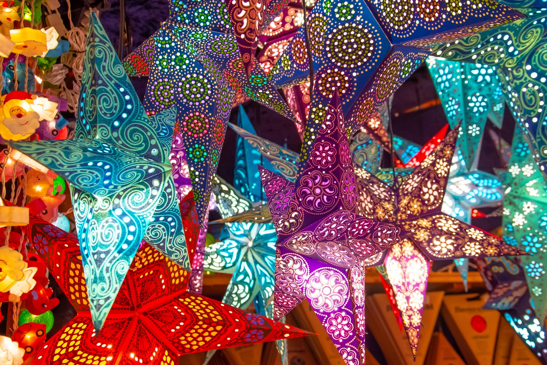 Paper bright multi-colored Christmas and New Year stars decorations